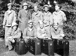 A group of trainees in photography during WWII, with boxes for "Type-C-I" ground cameras.  Edward H. Dixon is standing in back row, far left.