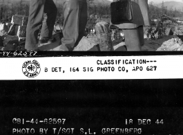 Col. J.W. Sells, Brig Gen. Frank Dorn, and Maj. Gen. Hsiung Pin look over the ruins of Tengchong from the city walls.  December 18, 1944.  Photo by T/Sgt. S. L. Greenberg. 164th Signal Photographic Company.  Passed by William E. Whitten.