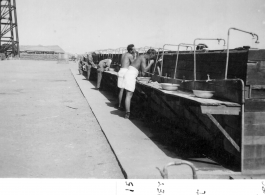 Washing facilities for GIs at the dirigible hanger at Karachi air depot, India. March 15, 1942.