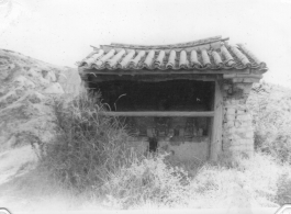 A local alter to a protective deity, apparently Guandi (关帝庙), near Kunming, China, area during WWII.