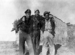 Three American flyers pose together in China during WWII. Stan Mamlock on far left.