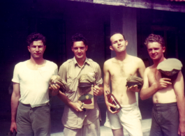 American flyers goof in front of barracks in China.