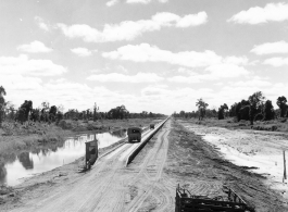 797th Engineer Forestry Company in Burma: Causeway through marsh on the Burma Road.  During WWII.