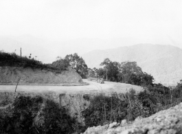 Truck carrying pipe on road in Burma.  During WWII.  797th Engineer Forestry Company.