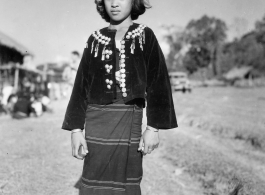 Local people in Burma near the 797th Engineer Forestry Company--A Kachin girl dress for Christmas on December 25, 1944, in Burma.  During WWII.