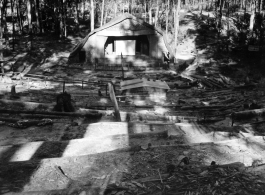 Outdoor amphitheater for 797th Engineer Forestry Company, in Burma, built into circular hillside, with logs for seats.  During WWII.