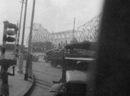 Howrah Bridge in Calcutta, India, as seen from transport truck, 2005th Ordnance Maintenance Company, 28th Air Depot Group, in India during WWII.