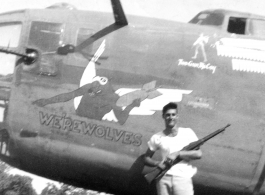 Pilot Edward "Two-Gun" McCoy posing with M1903 "Springfield" rifle in 1943 before his plane, B-24 WE'REWOLVES. His stance matches the image of him painted by Thomas Grady near the pilot's window, above him.  (Thanks to John Olin for supplemental info about his grandfather "Two-Gun" McCoy!)