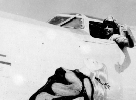 Pilot Mike Howes motions out cockpit window of F-7A/B-24. 24th Combat Mapping Squadron, 8th Photo Reconnaissance Group, 10th Air Force.