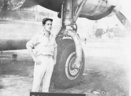 Bill Rumler poses by landing gear of a F-7A/B-24. October 4, 1945, Gushkara, India.  24th Combat Mapping Squadron, 8th Photo Reconnaissance Group, 10th Air Force.