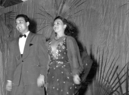 Dancing at a USO show in Gushkara, India, during WWII.  The boxes in front of the band players are labeled 748th ROB (748th Railway Operating Battalion).