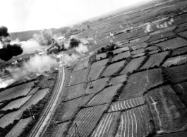 Low altitude bombing of railway near Van Trai Railroad Station, likely French Indochina. 