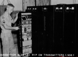 Transmitter building, air-ground and PX point-to-point CW transmitters. S/Sgt. James Whalen(?). AACS Sta. No. 251, 128th Squadron, Chanyi, China.