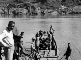 Photographer Pfc J.C. Bowermaster crossing a river in Guangxi province, near Liuzhou city.