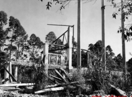 Bob Riese and friend explore remains of aircraft factory and hangers at the air base at Liuzhou, in 1945. The facilities at the base were first destroyed by the Chinese and Americans during retreat in the face of Ichigo during the fall of 1944, then may have been destroyed more by American bombardment during Japanese occupation, and possibly destroyed more by the Japanese as they retreated the area in 1945.