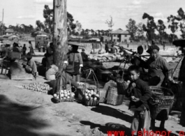 A roadside produce market in China during WWII.