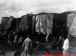 Allied gas train at the edge of the field, Liuzhou (Luichow), China Sept 1944, after a Japanese bombing raid, during WWII.