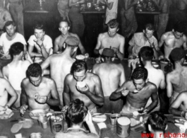 GIs getting a meal at mess on ship on the way back to the US after the war. The ship is probably the SS Marine Raven.