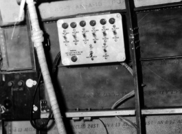 An indicator panel next to the door of a C-46 or C-47 transport's cargo door, used to coordinate air dropping of supplies.