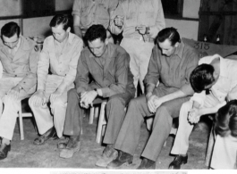 Men praying during a religious service.1139th QM Co Serv Group (AVN). Sector No. 2, CASFC.