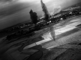 A large bomb explosion as seen from a bomber during allied bombing in the CBI.