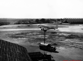 A C-47 transport plane with propellers turning, most likely in Assam, India.    From the collection of David Firman, 61st Air Service Group.