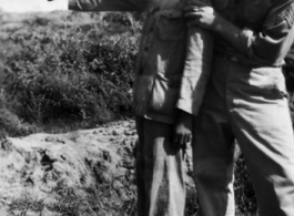 Robert Zolbe teaches the barracks houseboy how to shoot a pistol. In China during WWII.