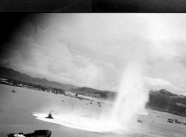 Bombs exploding near Japanese shipping during raid on Hong Kong. Images from bombing mission on Hong Kong, 491st Bomb Squadron.