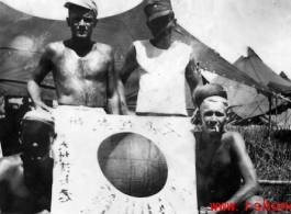 GIs show off trophy captured Japanese Good-Luck Flag  (寄せ書き日の丸) collected on the battleground in the CBI during WWII.