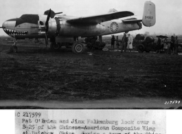 Pat O'Brien and Jinx Falkenburg look over a B-25 of the Chinese-American Composite Wing (CACW) at Liuzhou (Liuchow), China, during a tour of the China-Burma-India Theater (CBI) of Operations with a camp show.  In the background coolies pull up carts loaded with gasoline drums.  11-2-1944