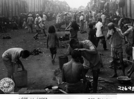 October 7, 1944  Congestion and lack of sanitation shown in crowded station at Liuchow (Liuzhou), Kwangsi (Guangxi) as refugees wait movement westward during WWII.   Photo: Lt. N. J. Dain, Liuzhou, China.