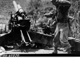 September 14, 1944  Pvt. W. E. Shemorry, Williston, N. Dakota, about to fire 150MM gun Howitzer, 10th Artiillary Regiment 11th A/G, firing on Lungling.