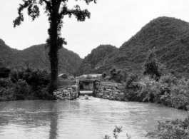 Scenery, including a canal or other water work, in southwest China, either Guangxi or Guizhou province, during WWII.