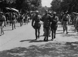 A Chinese prisoner being taken to execution site by Nationalist soldiers during WWII.