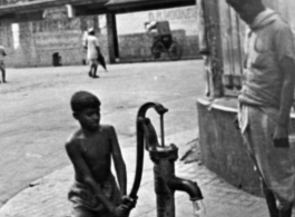 A public water well in front of Calcutta's New Market (Hogg's Market), during WWII.  Photo from Mary Bernald.