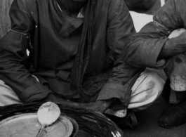 Food seller in India during WWII.  Photo from S. Louff.