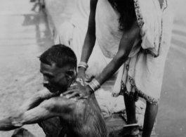 A domestic riverside bath in India during WWII.  Photo from John C. Martin.