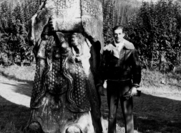 Bill Boselay stands next to a Ming Dynasty statue in the Palace Garden in Nanjing, 1945.  Photo from Bill Boselay.