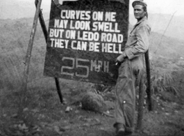 Eye-catching sign along the Ledo Road encouraging GI drivers to slow and take care on their way to China, during WWII.   Photo from Frank Wright, 885th Ord H.A.M. Co.