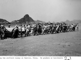 Chinese laborers pull a heavy roller on a runway at an American airbase at Guilin (Kweilin), China, during WWII.  From Paul Jones.