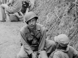 Medic, Captain Borak, on the Burma Road, tends to a Chinese soldier's wounds during the Salween River Campaign, 1944.  Photo by T/Sgt. Syd Greenberg.