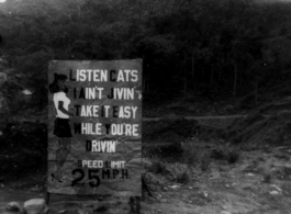 A road sign along the Ledo Road. The styling of the sign is testimony to the large number of African-American drivers and personnel on the road.  Photo from George E. Pollock.