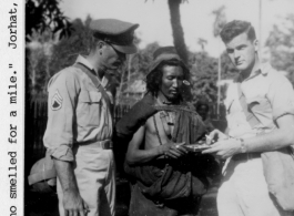 Oscar Chapman, and John Turner pose with a Kachin man at Jorhat, India, during WWII.