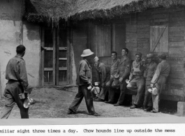 Mess line at Camp Kanchrapara, India. Here are personnel of the 164th Signal Photographic Company.  Photo by Syd Greenberg.