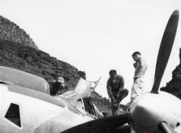 GIs work on a P-38 in Guangxi province, China, during WWII.