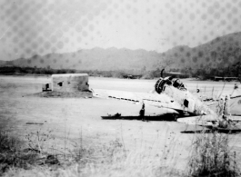 Ruined Japanese Zero at Warazup, Burma, during WWII.