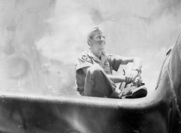 A GI sits on the wing of an airplane in the CBI during WWII. "Rob Kelt"