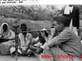 A GI tries out a smoking pipe in the old Delhi market in 1942.