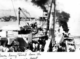 Marine Raven being towed down the Hooghly River as the GIs depart Calcutta on their way home after the war, in 1945.