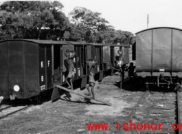 A train being loaded by hand in India during WWII.